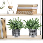 Winlyn Set of 2 Small Potted Plants Artificial Eucalyptus Plant in Black Geometric Ceramic Pots Faux Potted Greenery 7.1" Tall for Desktop Modern Home Office Living Room Kitchen Table Decorations