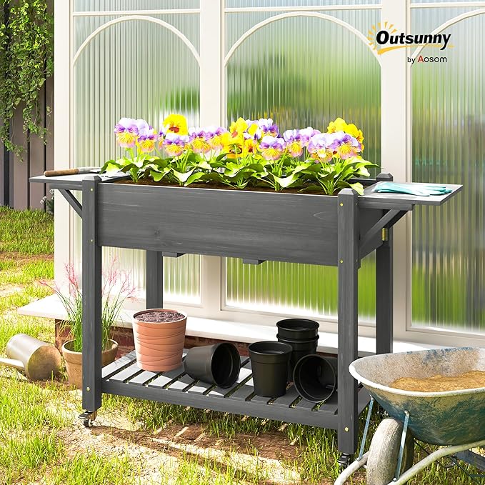 Outsunny Raised Garden Bed, 57 x 20.5 x 34 in Wood Elevated Planter Box with Lockable Wheels, Side Tables and Bottom Shelf, Outdoor Raised Planter with Bed Liner and Drainage Holes, Gray
